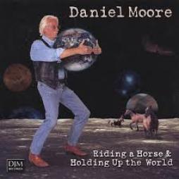 Riding_A_Horse_%26_Holding_Up_The_World-Daniel_Moore